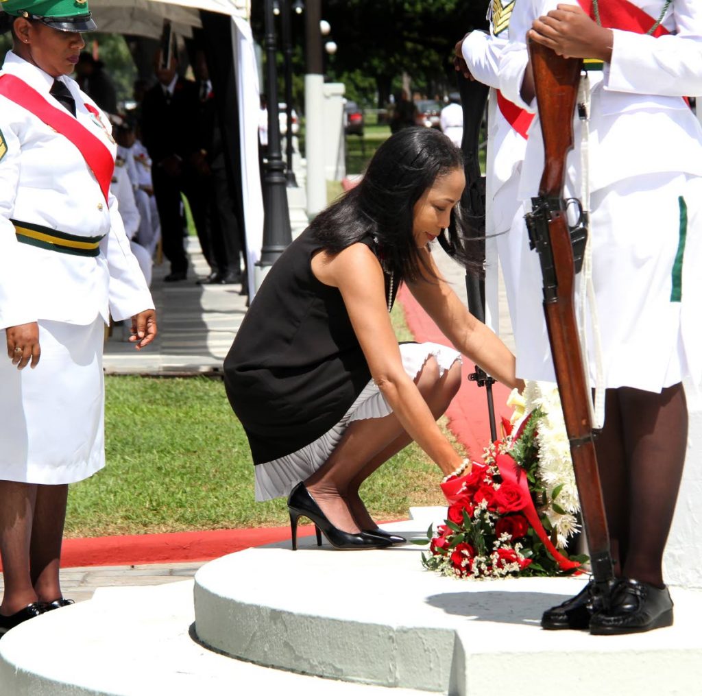 LAYING WREATH: The wife of Prime Minister Dr Keith Rowley, Sharon lays a wreath at the cenotaph during the Remembrance Day service yesterday at Memorial Park, Port of Spain. PHOTO BY SUREASH CHOLAI