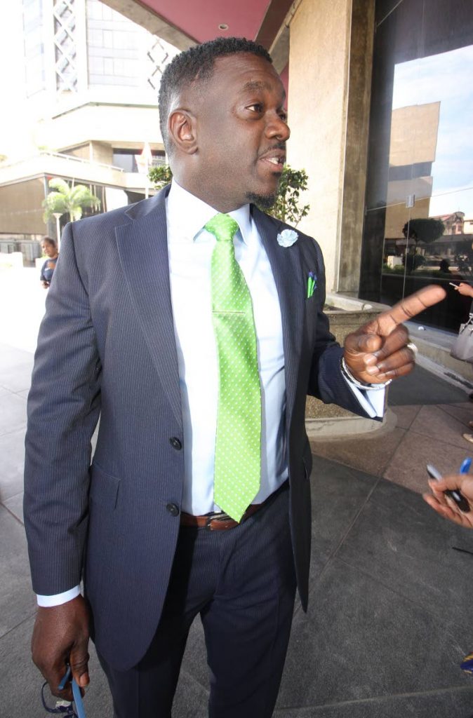 PSA president Watson Duke speaks with reporters outside the Financial Complex in Port of Spain yesterday.