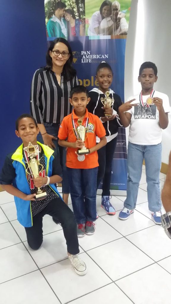 Young chessist Rayden Rampersad, second from left, will be competing at the First Flight Chess Life tournament on Saturday at the Brian Lara Academy in Tarouba.
