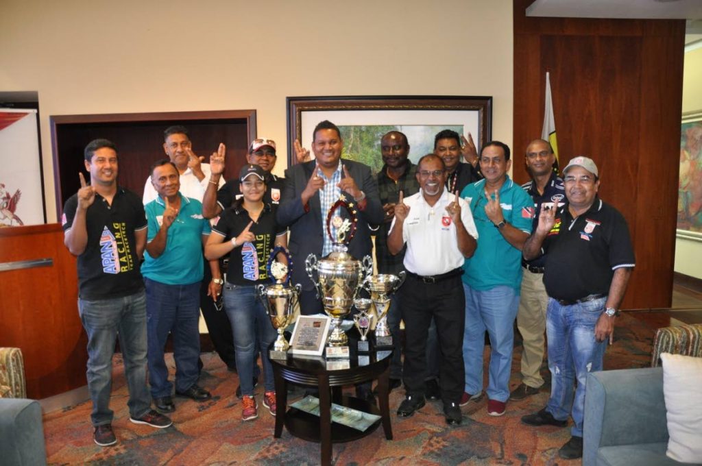 Minister of Sport and Youth Affairs Darryl Smith, along with the management team of the TT Automobile Association and members of the TT soca racers team at the VIP Lounge of the Piarco International Airport, on Tuesday.