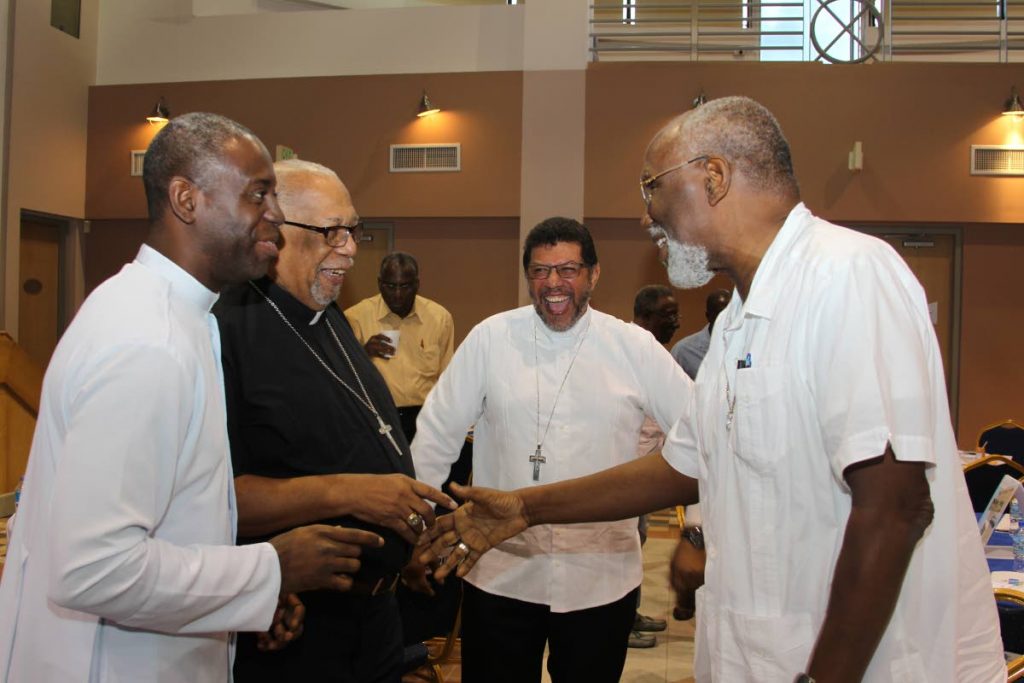 From left, Father Pax Finbar Jey-Sharwan VC, Archbishop Joseph Harris, Archbishop-elect Charles Gordon and Bishop of Grenada Clyde Harvey enjoy a light-hearted moment at St Dominic’s pastoral centre in Diego Martin yesterday.