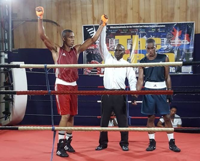Aaron Hassette (left) was adjudged the winner over Romel Lezama (right) in their welterweight bout during the 2017 National Boxing Championships on Friday.