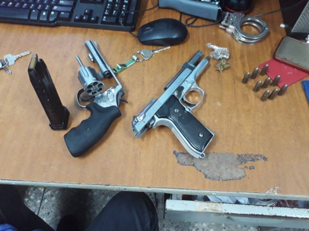 SEIZED: Guns and ammunition seized by police after they arrested four men at a bar in Princes Town over the weekend.