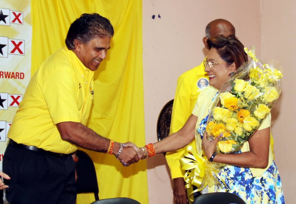 Dr Roodal Moonilal shows his support for Kamla Persad-Bissessar at a meeting she held in Claxton Bay on Monday night. PHOTO BY ANSEL JEBODH