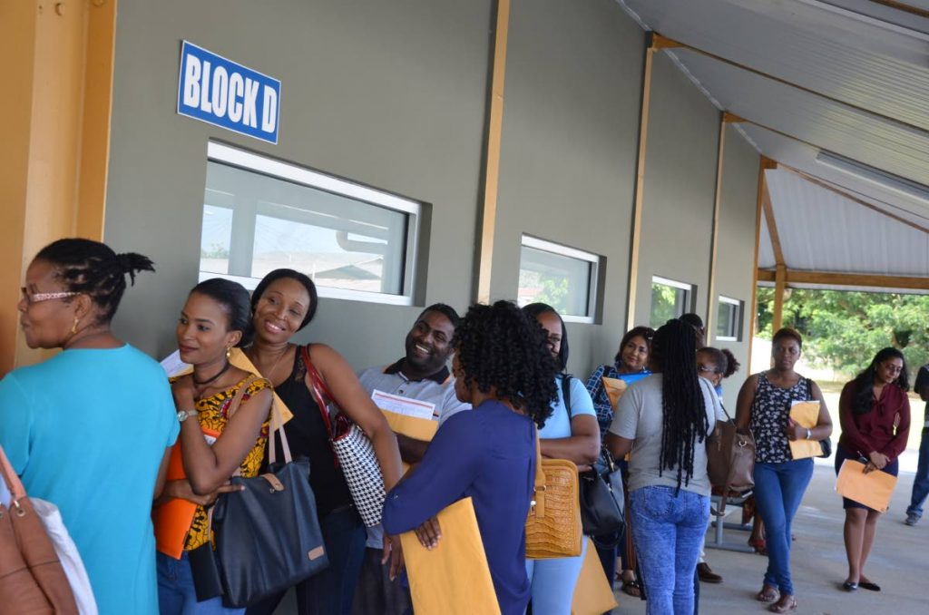 Government's Aided Self-Help Housing Programme applicants wait to submit forms at the HDC's Couva Village Plaza, Lisas Gardens, Couva. PHOTO COURTESY THE MINISTRY OF HOUSING.