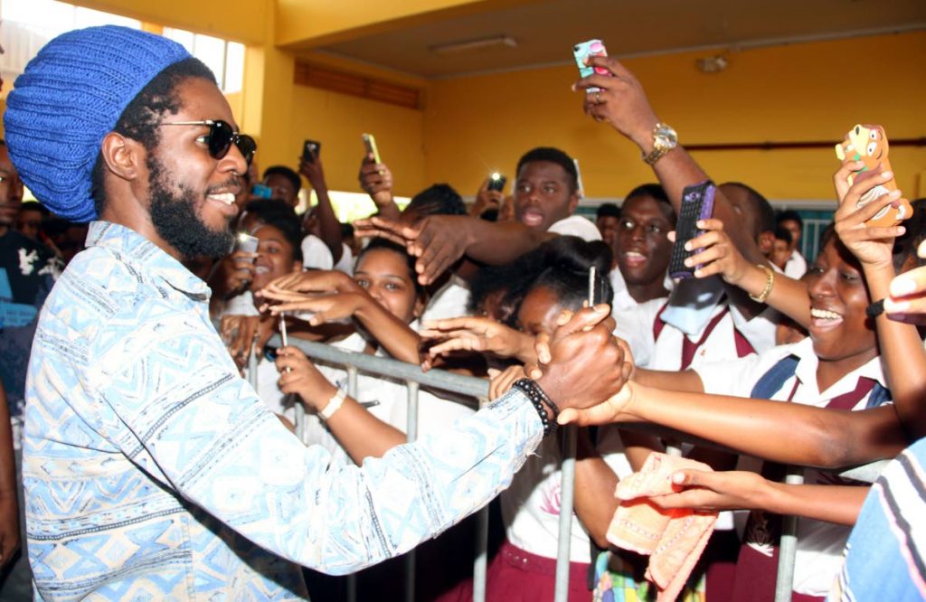 Pleasantville Secondary School students show Chronixx nothing but love at San Fernando City Hall on Wednesday morning.