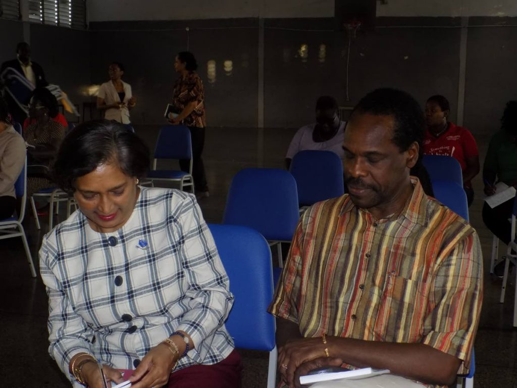 Principal of the Success Laventille Secondary School Hamida Baksh, left, shares a light moment with Laventille West MP Fitzgerald Hinds during the first meeting of the school’s Parent Teacher Association yesterday. PHOTO BY SHANE SUPERVILLE. 
