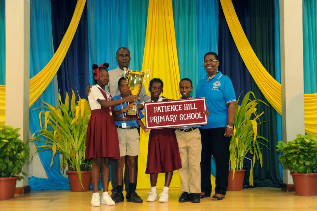 Students of the Patience Hill Government Primary School celebrate with their teacher, back left, after winning the Primary School Community Tourism Awareness Quiz, the final of which held on Tuesday at Lowlands Multipurpose Centre.