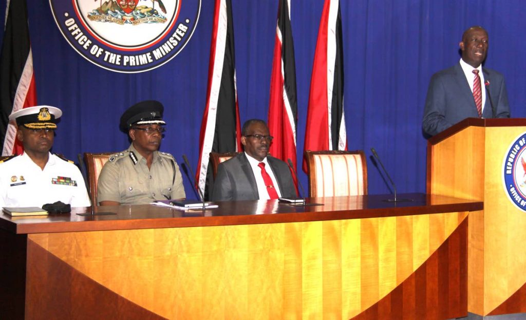 CRIME TALKS: Prime Minister Dr Keith Rowley addresses the media at the Office of the Prime Minister, St Clair. Also at the press conference from left is,  Chief of Defence Staff Commodore Hayden Pritchard, Acting Commissioner of Police, Stephen Williams and Minister of National Security, Edmund Dillon.