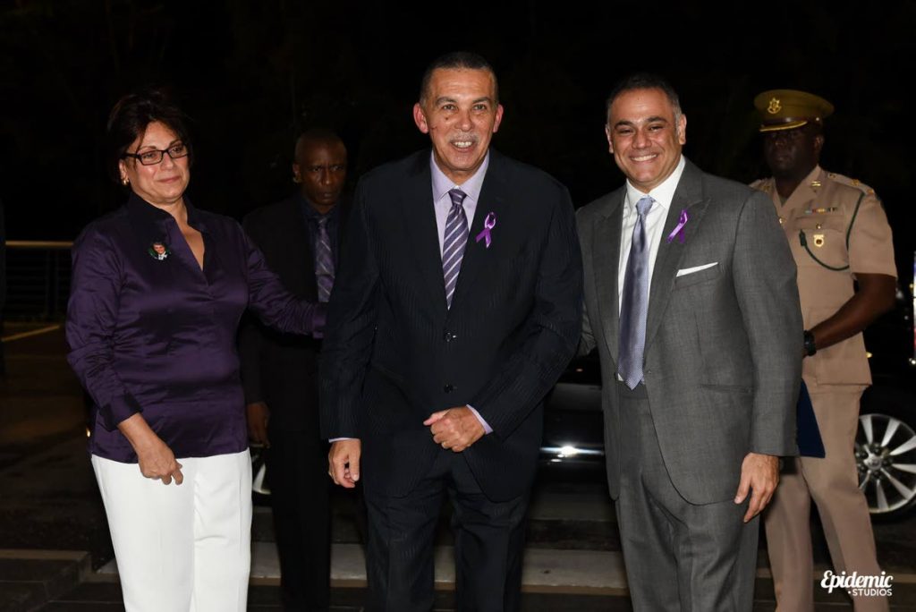 Natalie Sabga escorts President Anthony Carmona to the launch of the John E Sabga Foundation for Pancreatic Cancer at Prime Restaurant, Port of Spain on November 16. At right is Peter George, chairman of the foundation’s board. PHOTO COURTESY SCOTT  MCDONALD.