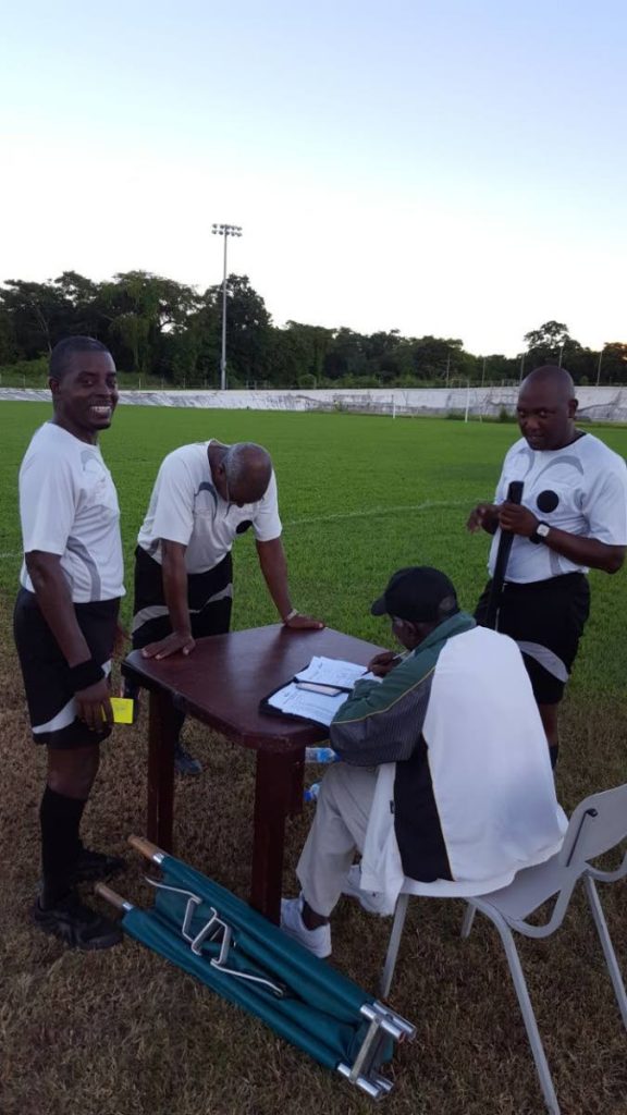 Head referee Roger Smith and his assistants Devon London and Junior Geoffrey at the Palo Seco Recreation Ground yesterday where they officiated the FC Santa Rosa vs Siparia Spurs game. PHOTO BY NICKOLAI MADRAY