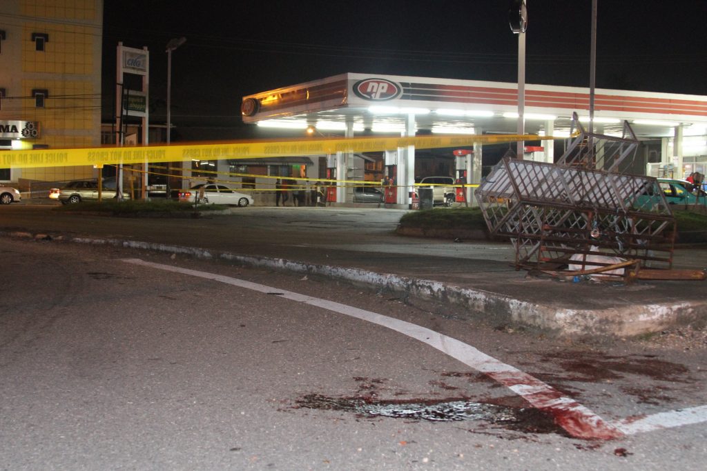 Bloodstains mark where two men were shot in Barataria at a gas station. PHOTO BY ROGER JACOB.