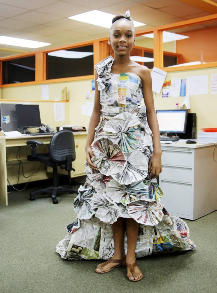 Print fashion: Xolani James,  a student of San Fernando Central Government Secondary, models her one-shoulder dress made out of Newsday newspapers at our Carlton Centre, San Fernando office on November 28. The dress was designed for a school project. Photos by Vashti Singh