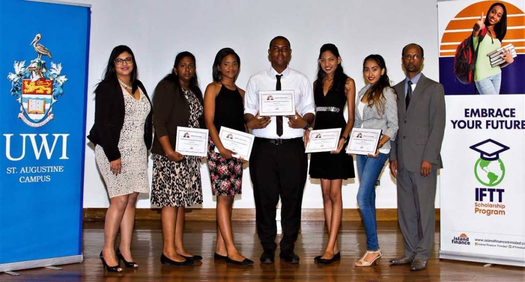 Island Finance’s Rehana Khan, left,  with Faaria Badal, Abigail Nelson, Gregory Isaac, Joselle Ali, Brithany Pajie and country manager Gladston Cuffie.
