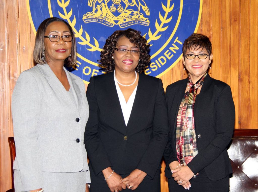JUSTICE LEAGUE: New judges (from left) Gail Gonzales, Sharon Gibson and Lisa Ramsumair-Hinds after they were sworn in by President Anthony Carmona at the Office of the President, St Ann’s yesterday.
