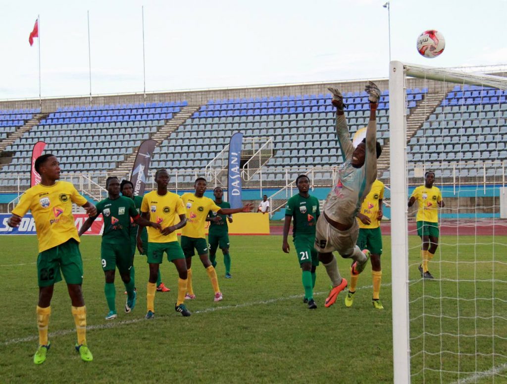 STRETCHED: Signal Hill Secondary’s goalkeeper, Duvaughn Daniel goes full stretch after an attempt on goal from the San Juan North Secondary outfit. San Juan won 1-0 in the Coca-Cola Intercol semis-final held at the Ato Boldon stadium yesterday.
