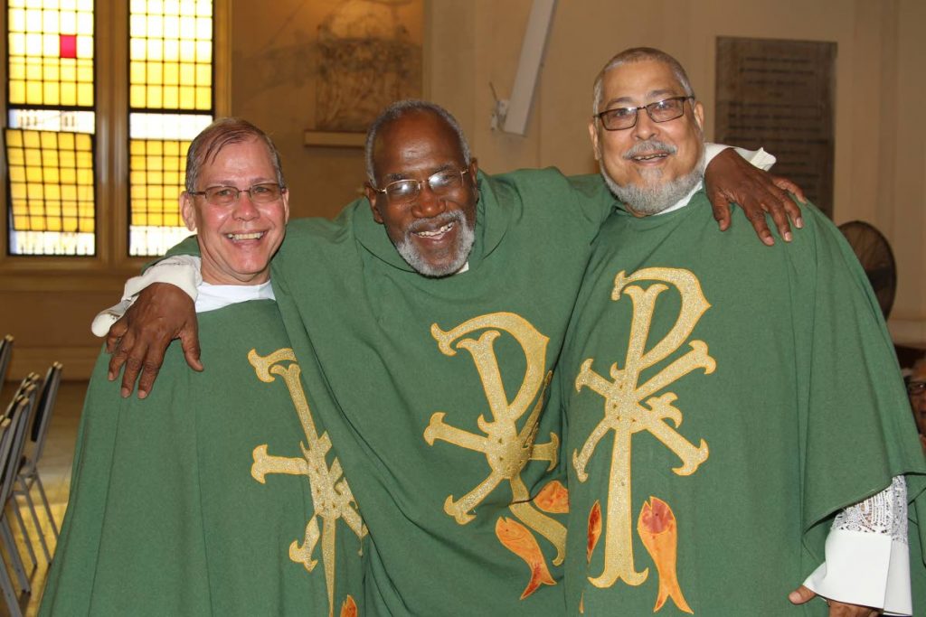 Bishop Clyde Harvey, centre, Vicar General Monsignor Christian Pereira, right, and Rt Rev John Pereira, Abbot of Mt St Benedict, at a service in June. Harvey is out of hospital after collapsing in Grenada. File photo