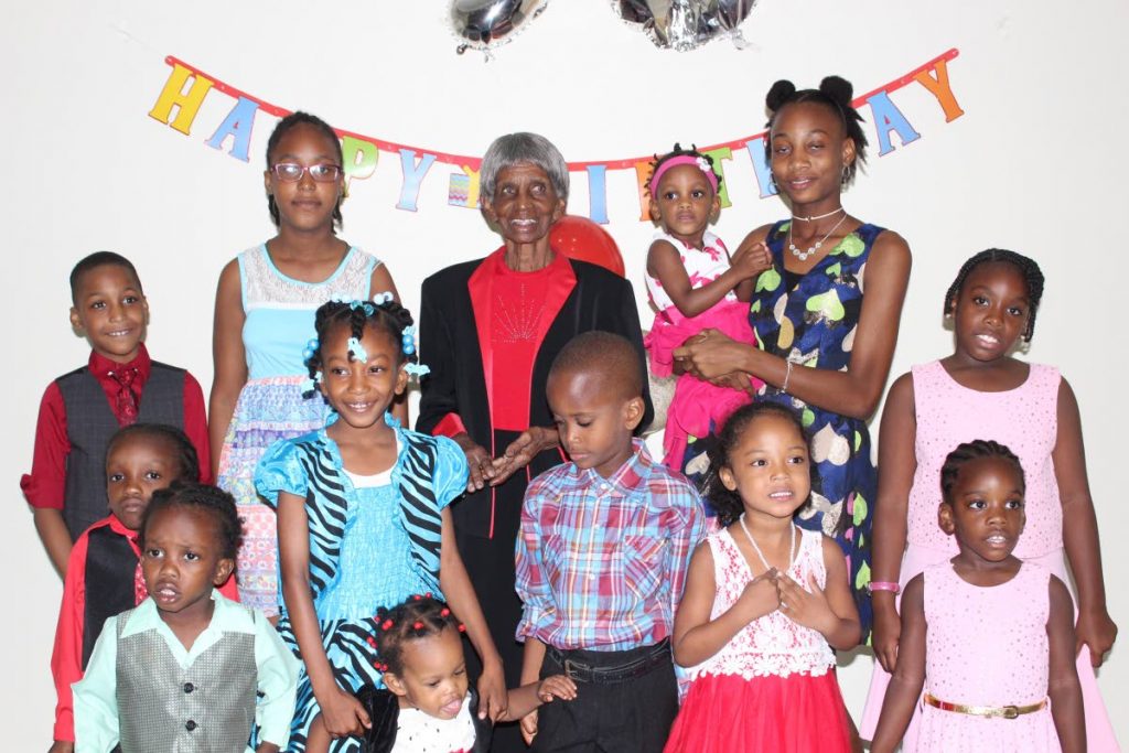 GRANNY LUCES (back row, centre) celebrates her 90th birthday with her children, grandchildren and great grandchildren at a party yesterday at Roslyn Hall, Auzonville Road, Tunapuna.