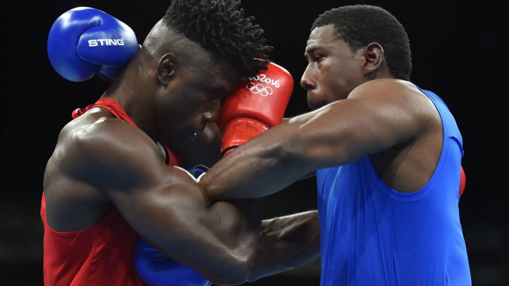 Trinidad and Tobago’s Olympic boxer Nigel Paul, right, in action against Nigeria’s Efe Ajagba at the 2016 Rio Games.