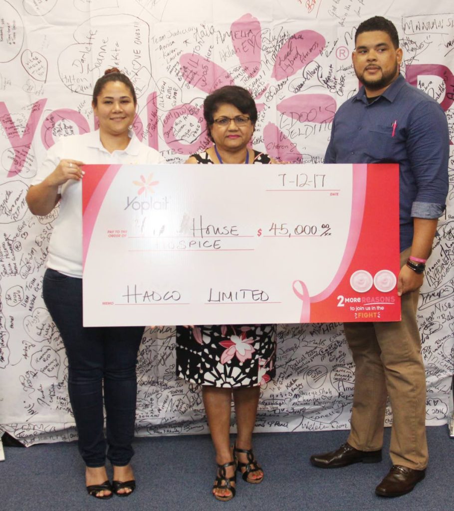 Hadco Marketing Manager, Kimberly Camacho and Hadco Brand Manager, Jonathan Chatoor (right), presents  Vitas House Hospice General Manager, Lilia Mootoo with a cheque towards breast cancer aid, at Hadco Ltd, Bhagoutie Trace, San Juan. PHOTO BY ANGELO MARCELLE. 