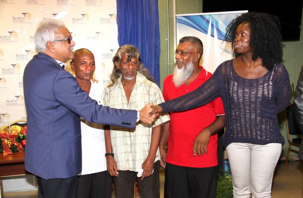 SURGICAL SUNDAYS: Health Minister Terrence Deyalsingh, far left, meets with four of the patients that benefitted from the Sunday surgeries, 2nd from left Roopchan Rampersad, Donald Mohammed, Harrylal Singh and Natalie Dyett. PHOTO BY SUREASH CHOLAI