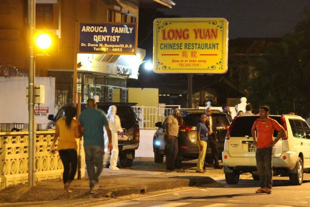 The scene at the Long Yuan Chinese restaurant where policeman Richard Babwah was shot dead during an attempted robbery yesterday evening.   PHOTO BY ROGER JACOB