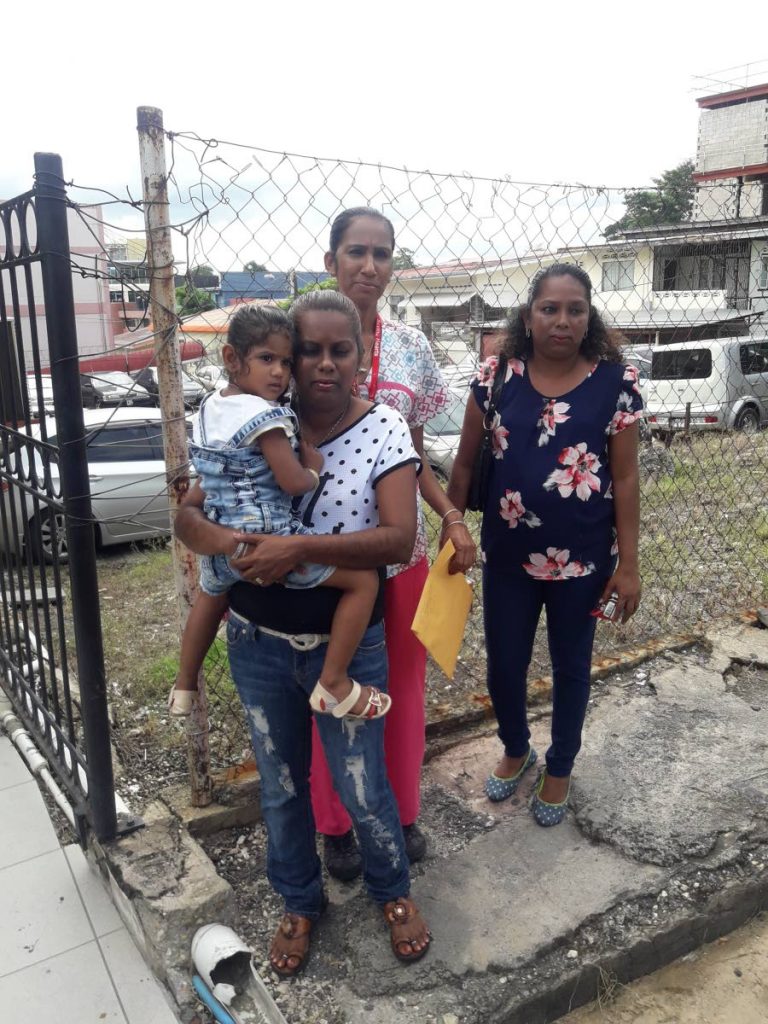 FORGIVING FAMILY: Vijanti Seudath (center)with other members of her family outside the San Fernando Magistrates’ court yesterday.