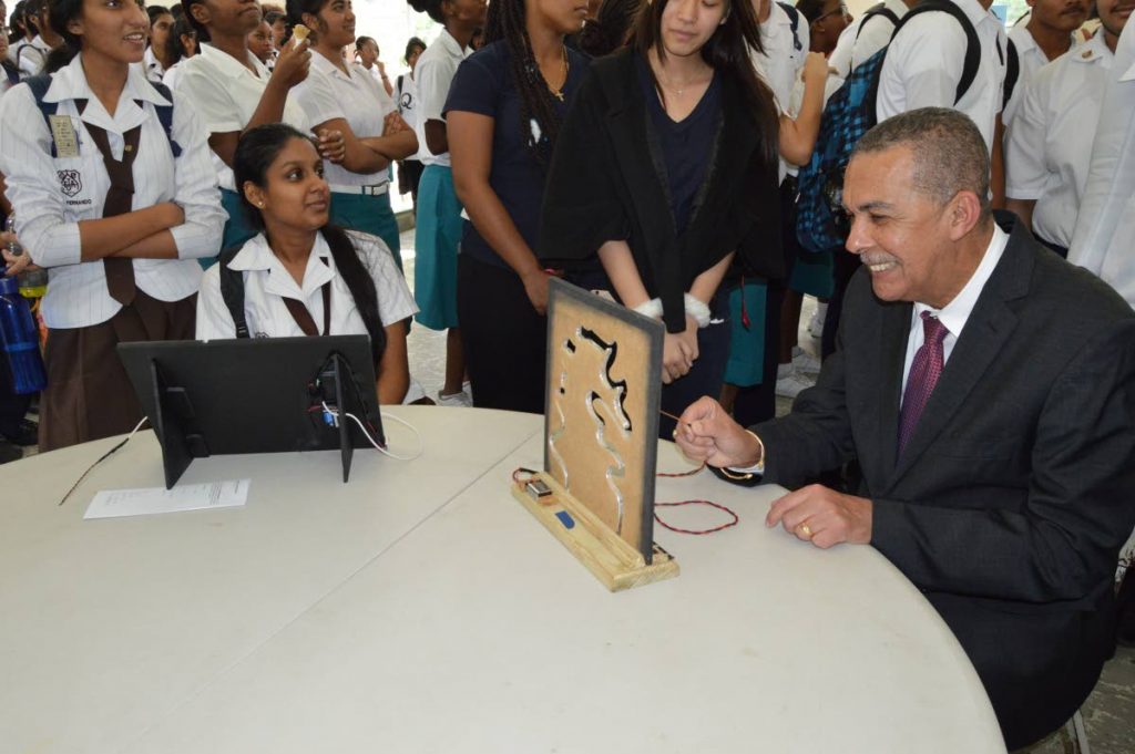 Nerve-racking: President Anthony Carmona tests his nerves at the nerve tester booth at St Joseph's Convent, St Joseph maths fair on December 12. Carmona's term ends on March 18, 2018. Photo by Ana-Lissa Jack