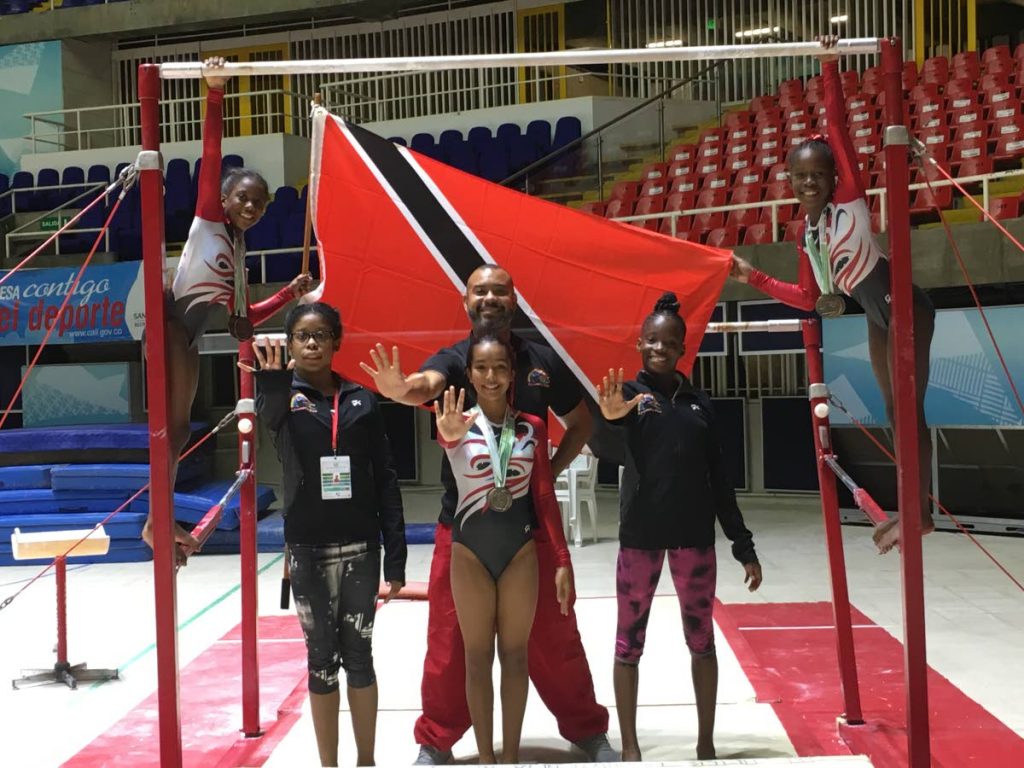 Members of the Tots and Tumblers Gymnastics Club pose with their coach in Cali, Colombia after copping five gold medals at the recently held PAGU Gymnastics Club Cup.