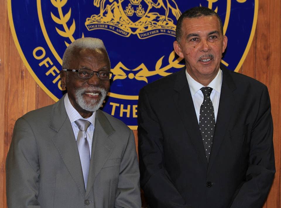 New chairman of the Integrity Commission, retired justice Melville Baird, left, shares a light moment with President Anthony Carmona during his swearing-in ceremony yesterday.