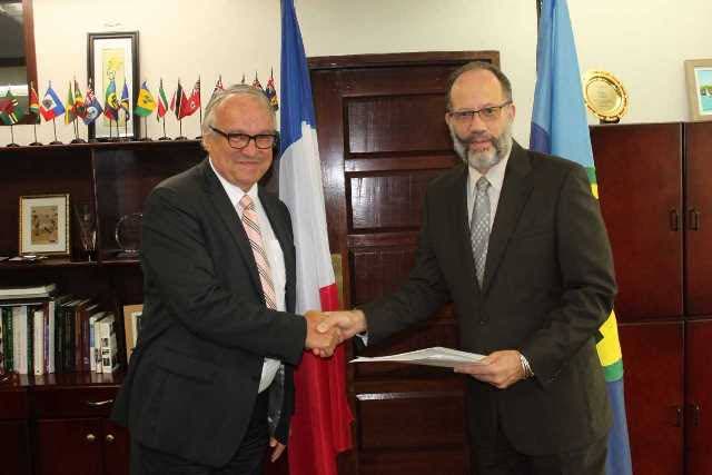 (Right) Caricom Secretary-General Ambassador Irwin LaRocque receives Letter of Credence from new Ambassador of France to Caricom, His Excellency Antoine Joly. PHOTO COURTESY CARICOM