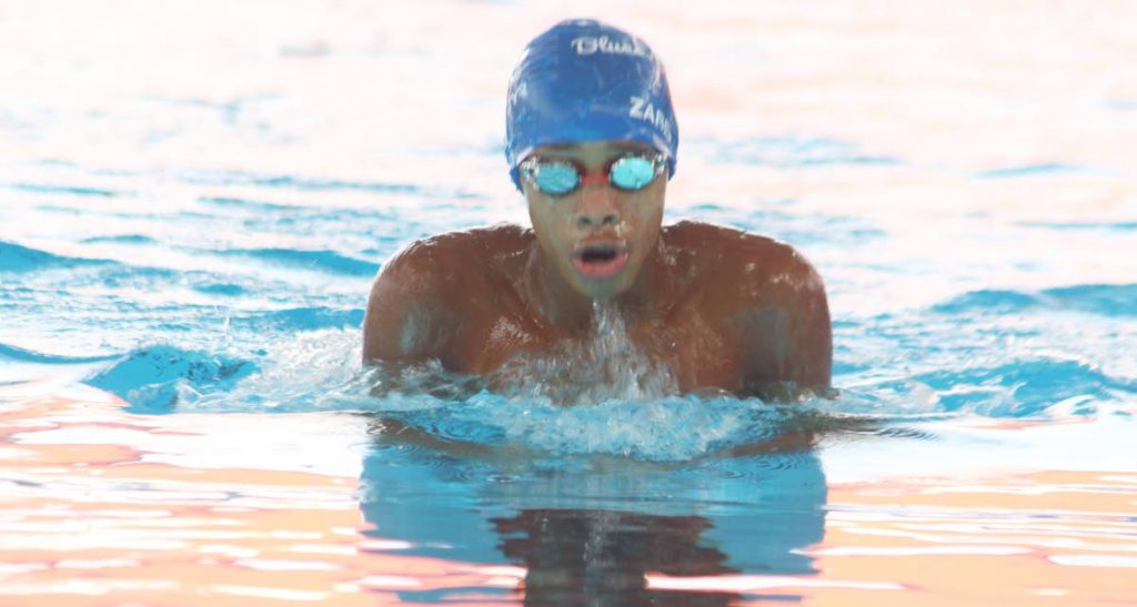 Zarek Wilson of Blue Dolphins competes in the Boys 11-12 400m Individual Medley at the ASATT Invitational Meet yesterday at the National Aquatic Centre, Couva.