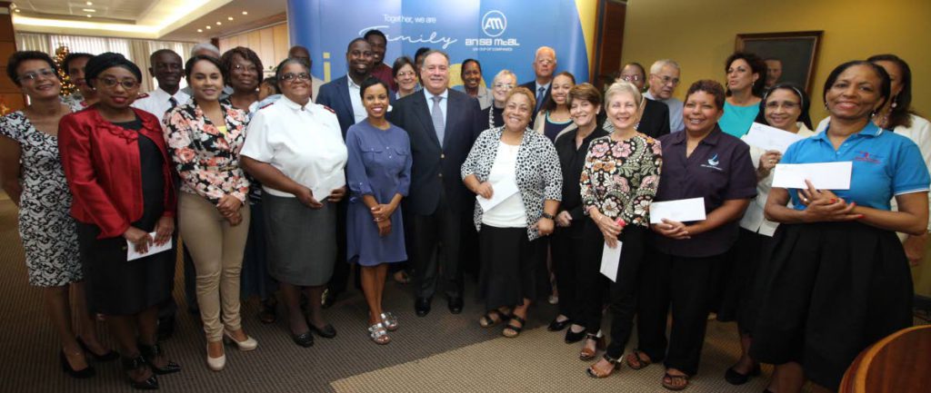 (centre)  Mr. A Norman Sabga, the Chairman of the Ansa Foudation with representatives from various charities and members of the foundation;Mrs. Judy Y. Chang, Mr. Ravindra Nath Maharaj, Ms. Diana Mahabir Wyatt, Fr. Ronald Mendes CSSp, Mr. Victor Mouttet, Mrs. Linda Sabga Hadeed, and Mr. Nabeel Hadeed
The Ansa McAl Foundation makes cheque presentations to twenty-four(24) recipients locally and regionallynational charities, Ansa McAl, POS. Tuesday, December 19, 2017. PHOTO BY ROGER JACOB.