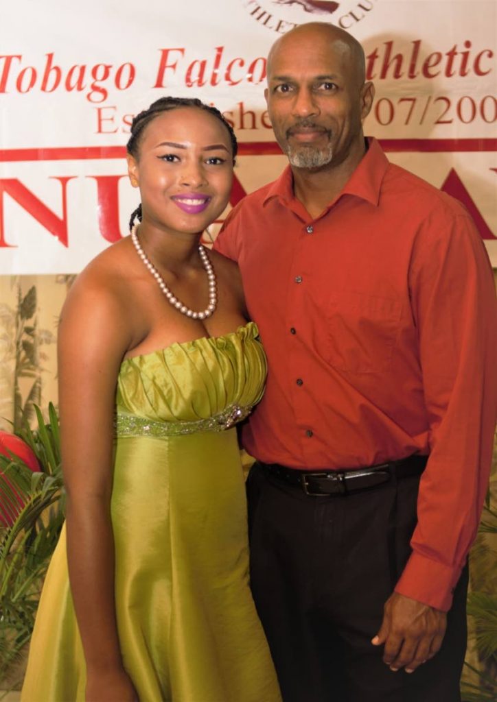Sports and Youth Affairs Secretary Jomo Pitt poses for a photo with Shakera Kirk, Most Disciplined Athlete, at last Sundays 18th Tobago Falcons Athletic Club awards ceremony at the Dept of Works conference room, Old Government Farm Road, Shaw Park. 