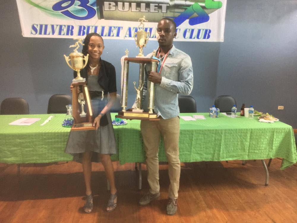 Jameel Joseph, right, and Christiemarie Maharaj, show off their Most Outstanding male and female trophies at the Silver Bullet awards ceremony held recently.