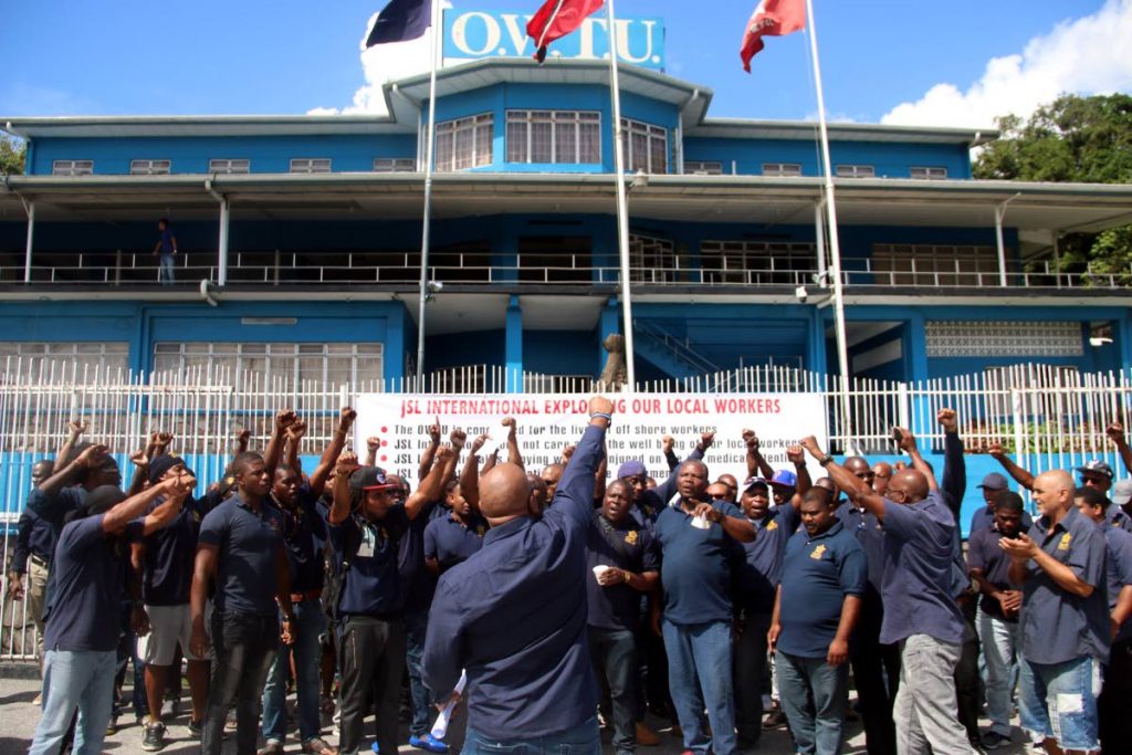 OWTU members stand outside their headquarters at Circular Street, San Fernando in solidarity with their comrades who claim they are being owed money by a company.