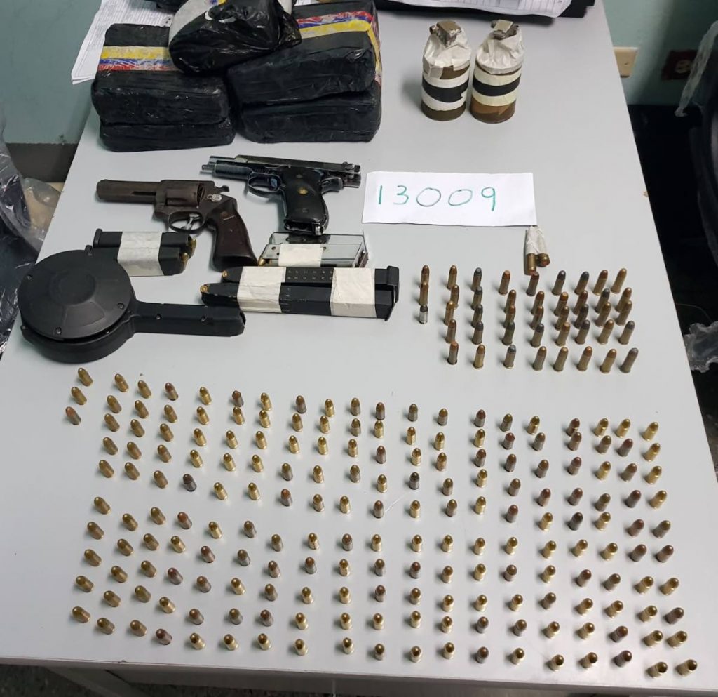Guns, grenade-like devices and ammunition found in Woodbrook on Friday night.