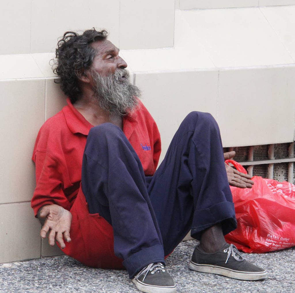 MY LIFE: Neil Christian spends his days sitting on Chacon Street, Port of Spain seeking monetary aid from passers-by.