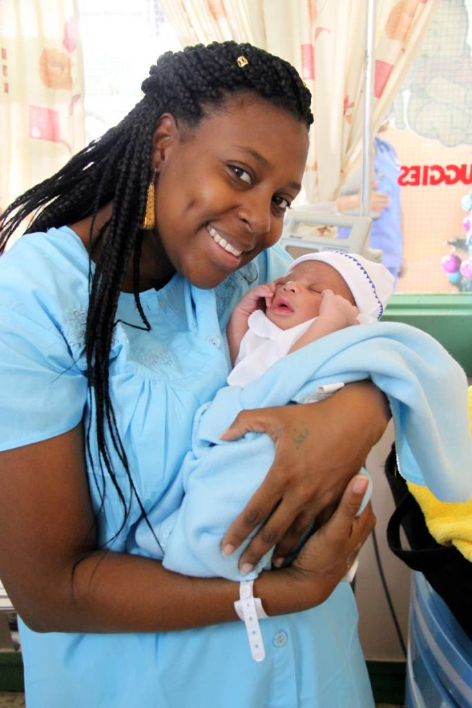 HE’S FIRST: Jewel Murray holds her newborn son Jahane, the first baby to be born on New Year’s Day, at the Mt Hope Women’s Hospital yesterday. (SEE PAGES 6 AND 7)
