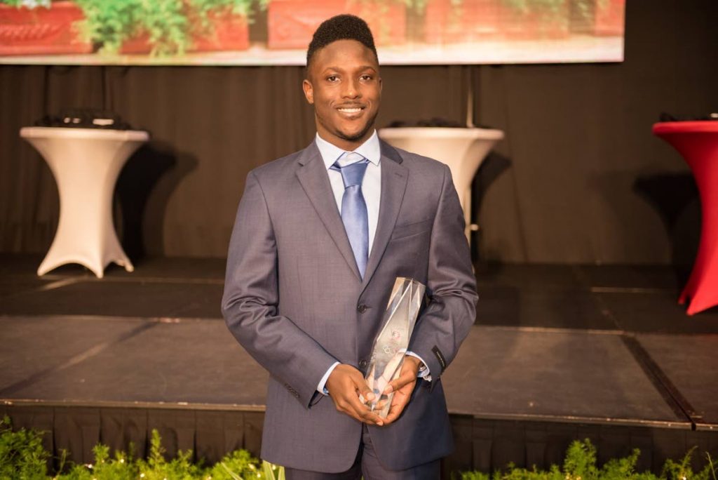 Adell Colthrust, who on Friday was awarded the TTOC’s Junior Sportman of the Year, poses with his trophy at the Hyatt Regency, Port of Spain after the TTOC’s awards ceremony.