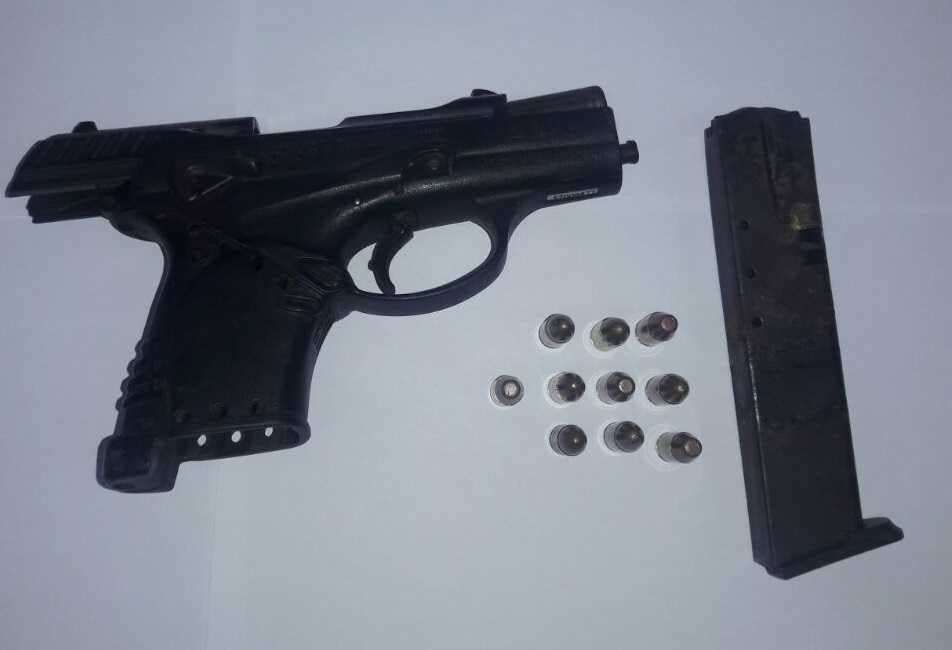 SEIZED: A pistol and ten rounds of ammuntion found in a car parked near the Sangre Grande police station. A CAL flight attendant and a woman were later arrested.