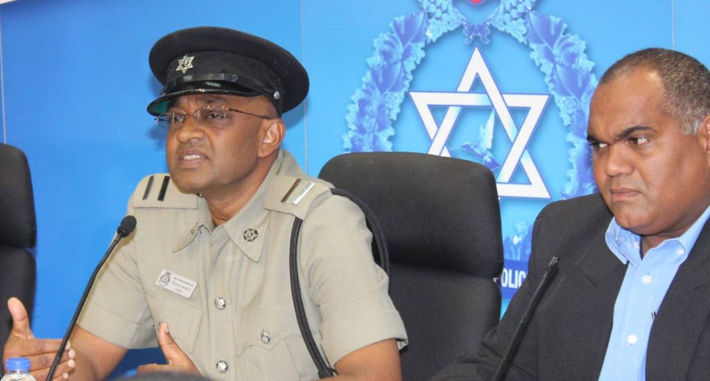 Ag ASP Kissoon Badloo, left, and Brent Batson at the police’s first press briefing for the year held yesterday at Police Administration Building in Port of Spain.