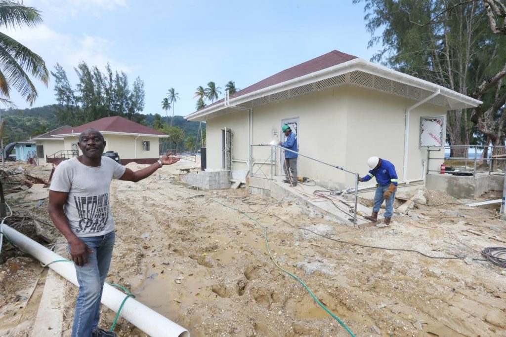 President of the Maracas Vendors Association Festus Imasekha points to one of the booths still under construction at Maracas Bay on Wednesday.