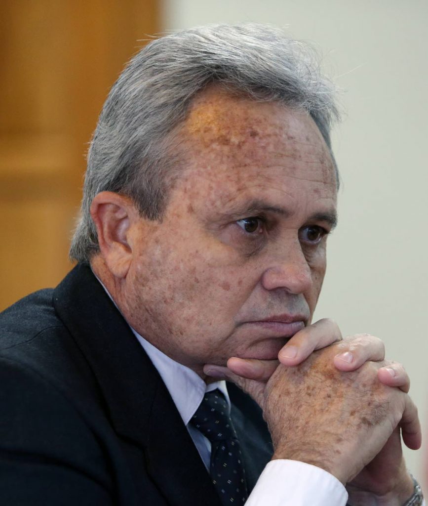 CUTBACKS: Finance Minister Colm Imbert in a pensive mood yesterday at a news conference held at his ministry at the Eric Williams Finance Building, Independence Square, Port of Spain.