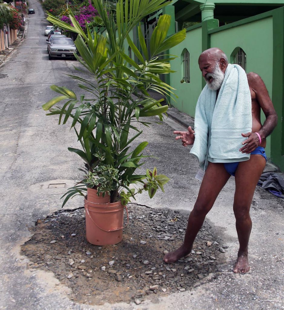 POOL PARTY READY: Ken Sammy says he is ready to get back into the hole if ever the repairs to a broken water main at Cuthbert Street, Diego Martin fails.
