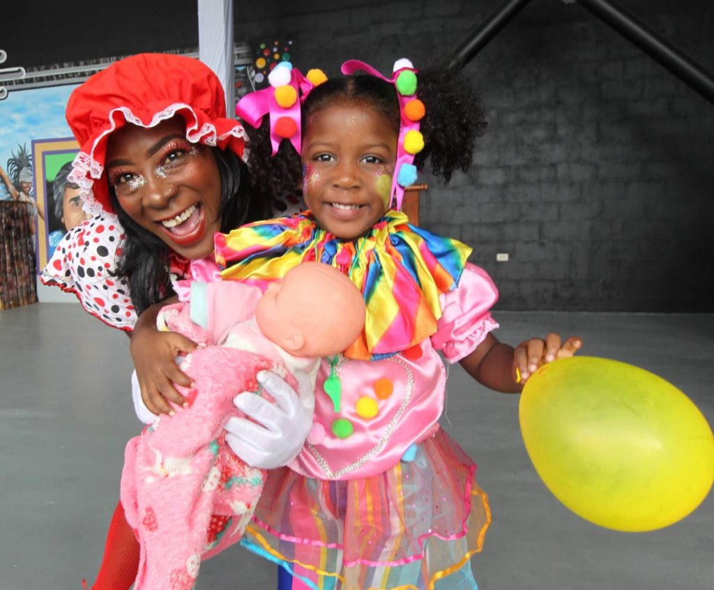 Orchid Matthias and her daughter Neema Herbert portray Baby Doll characters at the launch of Carnival 2018 at the Queen’s Park Savannah yesterday.