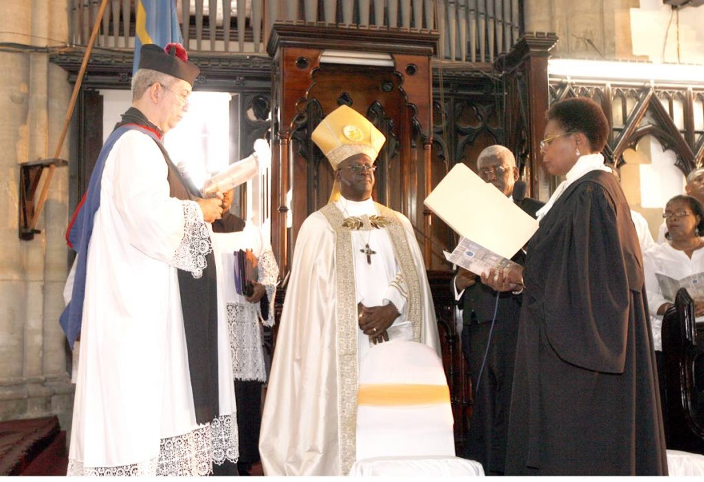 Holy service: Justice Paula Mae Weekes, right, as a principal officer of the Anglican Church participates in the enthronment ceremony of Bishop Claude Berkley at Holy Trinity Cathedral, Port of Spain on January 14, 2012. File photo by Rattan Jadoo
