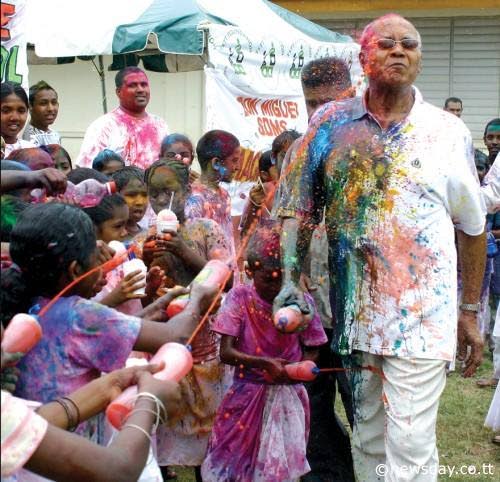 In this photo taken in 2009, then President George Maxwell Richards is sprayed with abeer during Phagwa celebrations at the Tunapuna Hindu School.