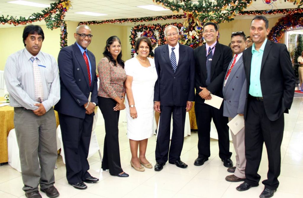 FLASHBACK: President George Maxwell Richards and his wife Dr Jean Ramjohn-Richards pose with members of the media at a luncheon at Knowsley Building in December 2012.