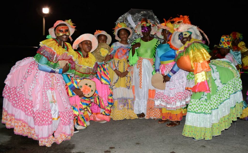 A group of Dame Lorraines pose for a photo in Roxborough for Carnival 2017